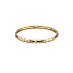 Gucci's 18K Yellow Gold Icon Bangle